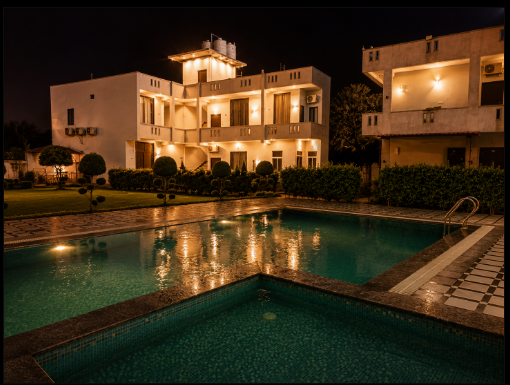 Swimming pool at Mandiya Villa surrounded by landscaped gardens.